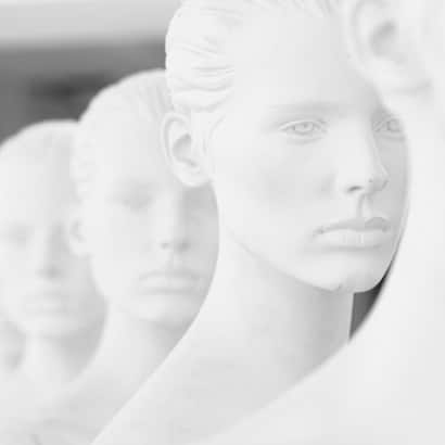 A row of white mannequins.